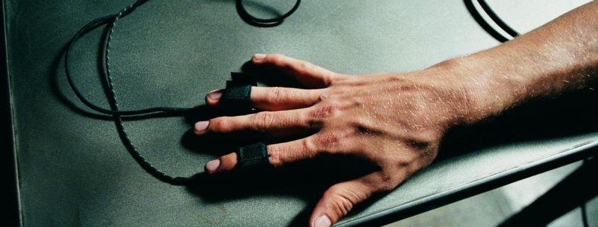 Hand attached to polygraph machine.